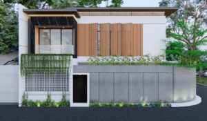 Fasad rumah Mr. AM dari sisi selatan memperlihatkan kisi kayu vertikal dan taman vertikal yang memperkuat nuansa tropis modern.