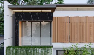 Balkon kamar lantai dua rumah Mr. AM dengan finishing marmer hitam elegan, railing kaca, dan tanaman rambat sebagai elemen penyegar.