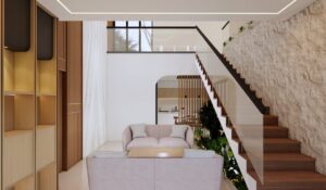 Ruang tamu rumah Mr. AM dengan tangga kayu dan dinding batu ekspos, menampilkan desain modern hangat dan elemen vertikal alami.
