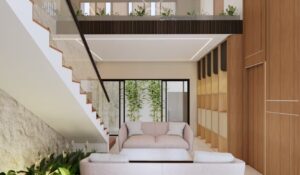 Pemandangan ruang tamu rumah Mr. AM dari arah tangga, dengan jendela besar yang menampilkan taman bambu dan sirkulasi udara alami.