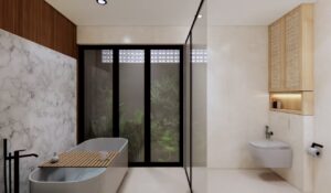 Kamar mandi utama rumah Mr. AM dengan bathtub modern, dinding marmer putih, dan pencahayaan natural dari jendela besar menghadap taman kecil.