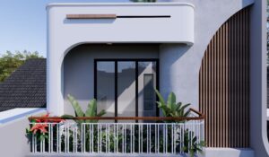 Area taman semi-outdoor dengan tanaman hijau di dekat tangga dan pintu kaca besar.